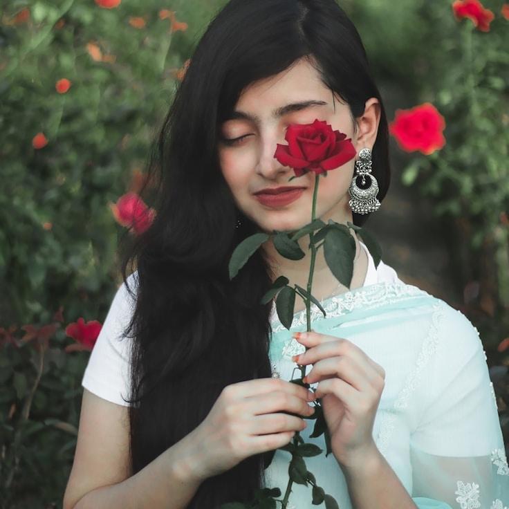 Avery Singh, Lead Design Curator at Urban Crest Hub, reviewing corporate floral arrangements